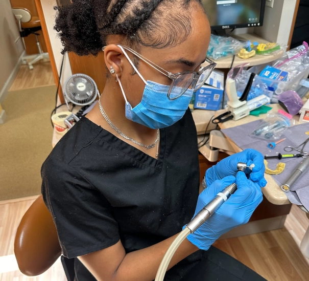 Dental Assistant School student training with a dental impression